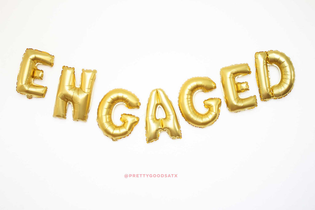 Engaged gold letter balloons