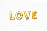 LOVE gold letter balloon banner